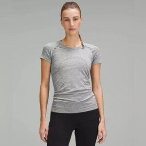 Lululemon Swifty Teck Short sleeve shirt, size 4, 2 shades Grey hip length.